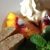 Photo: Grilled peaches finished with vanilla gelato